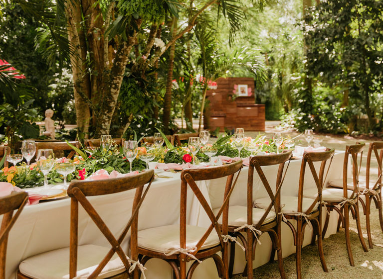 Rustic wooden seating and bar for garden wedding in Miami